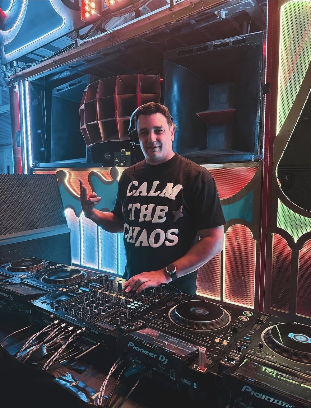 Louis IV behind the decks at a late-night warehouse set in Phoenix